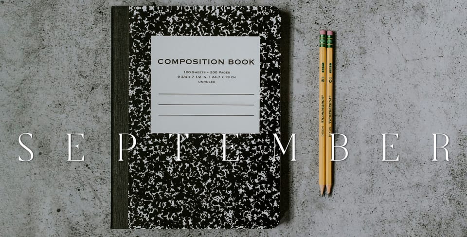 black and white composition notebook with two yellow pencils beneath the word "SEPTEMBER"